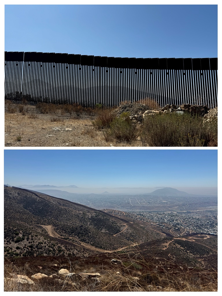 The US-Mexico border wall running through the Otay Mountains, with Tijuana stretching to the horizon