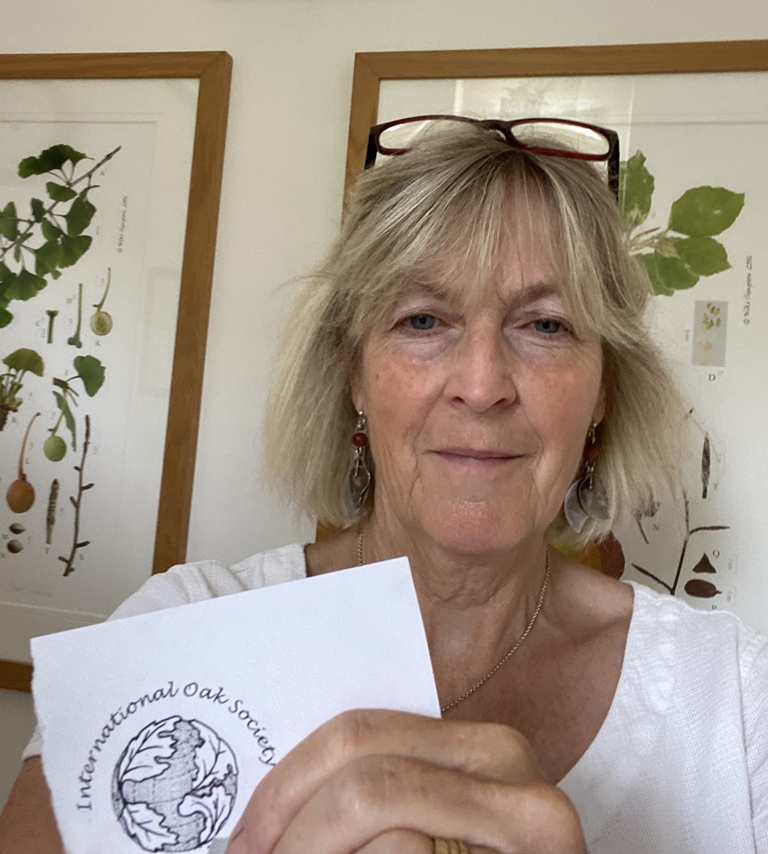 Niki Simpson with drawing of logo